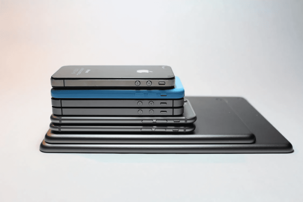 several generations of iphones on top of each other