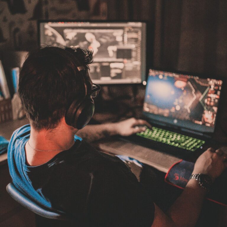 A man playing something on his gaming computer