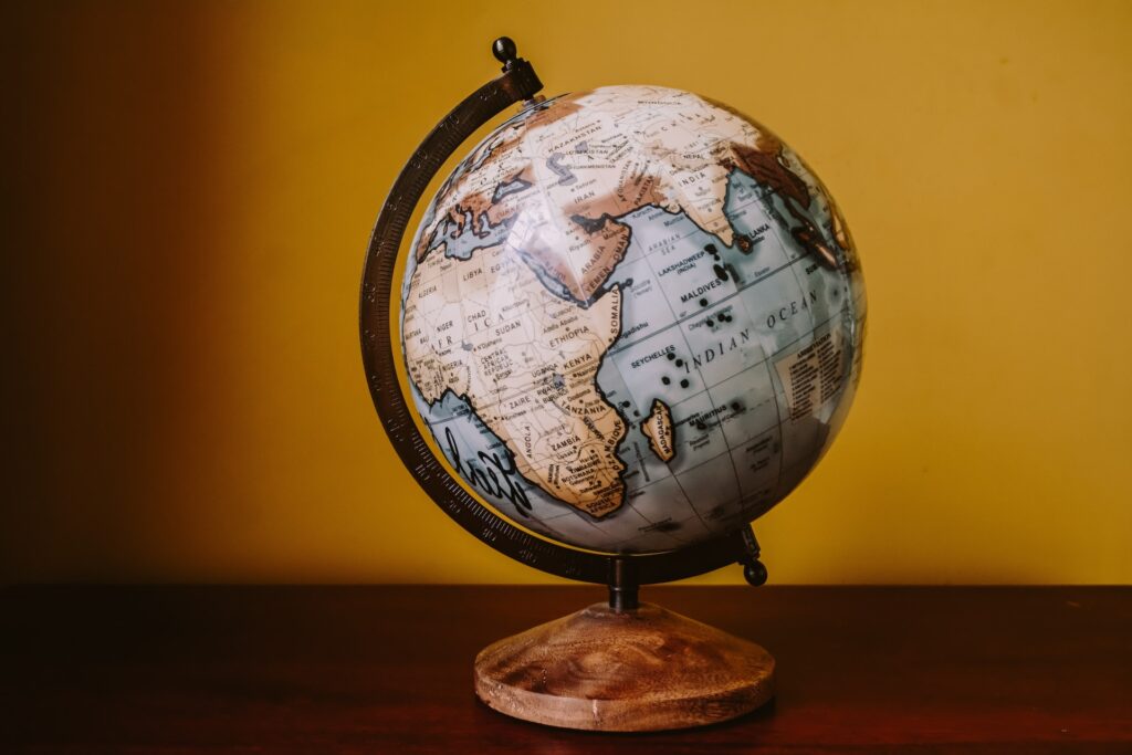 Image of a globe on top of a wooden table.