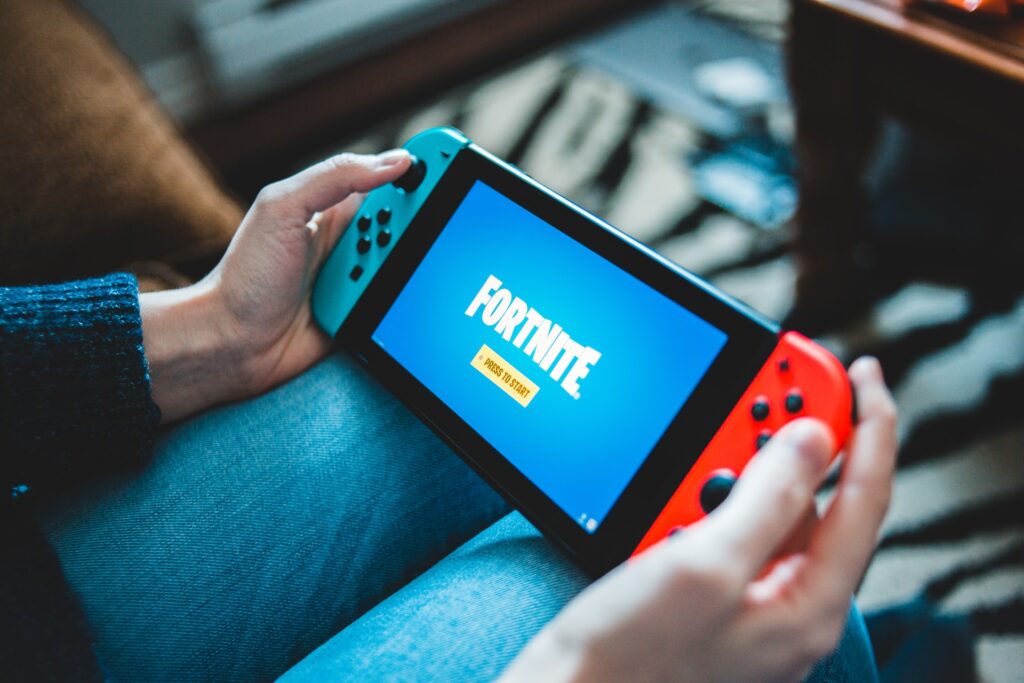 A picture of someone playing Fortnite on a Nintendo Switch.