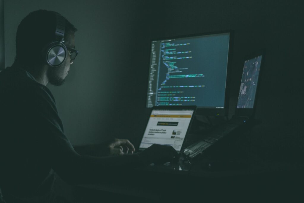 A man working as a programmer late at night.

What is a game developer?