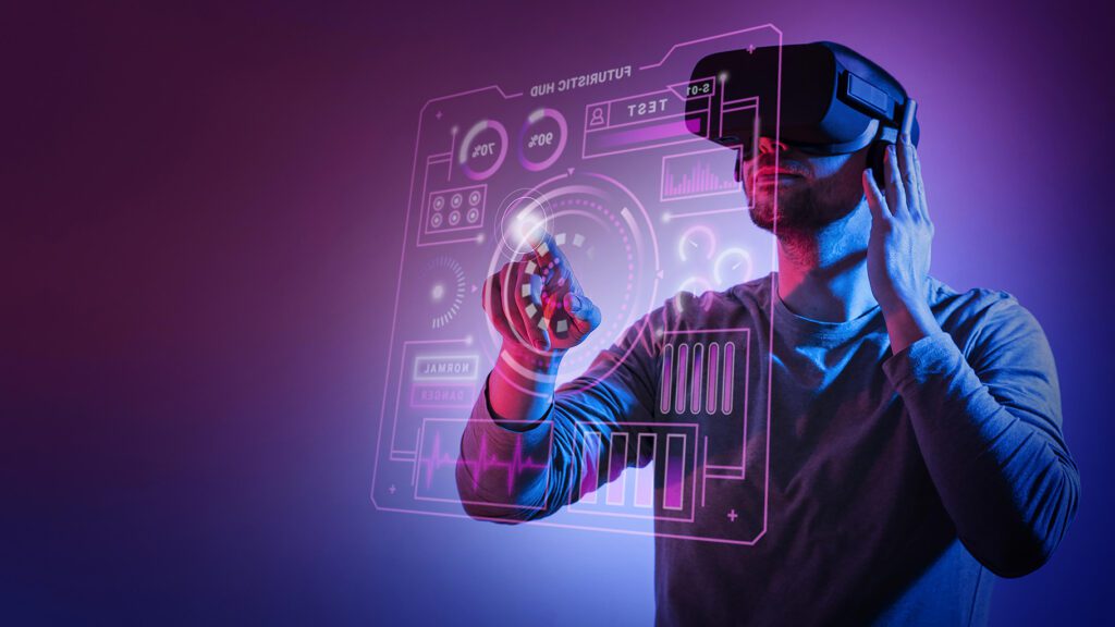 Photograph of a man wearing a VR headset and playing with a digital interface.

Virtual world creator