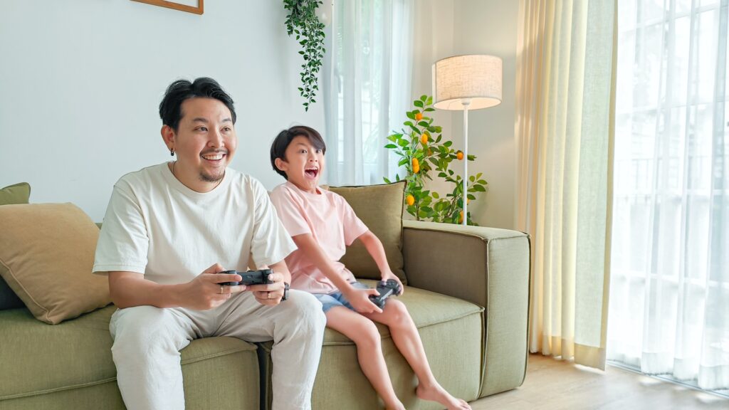 Photograph of a dad and his kid playing video games.

Console gaming compared to the PC market